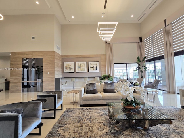 tiled living room featuring a high ceiling