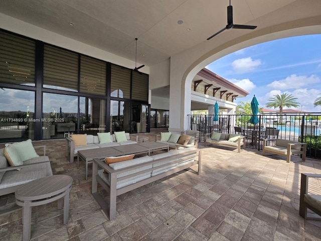 view of patio / terrace featuring ceiling fan and outdoor lounge area