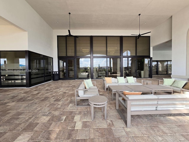 living room featuring a high ceiling