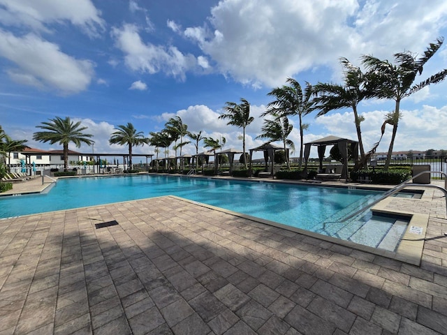 view of swimming pool with a gazebo and a patio