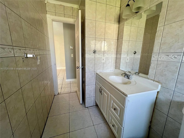 bathroom with tile walls, vanity, and tile patterned floors