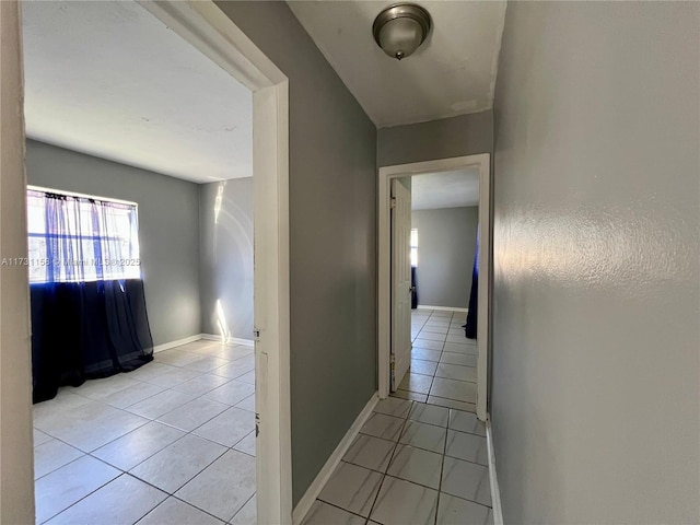 hall with light tile patterned flooring