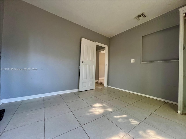 unfurnished bedroom featuring light tile patterned floors