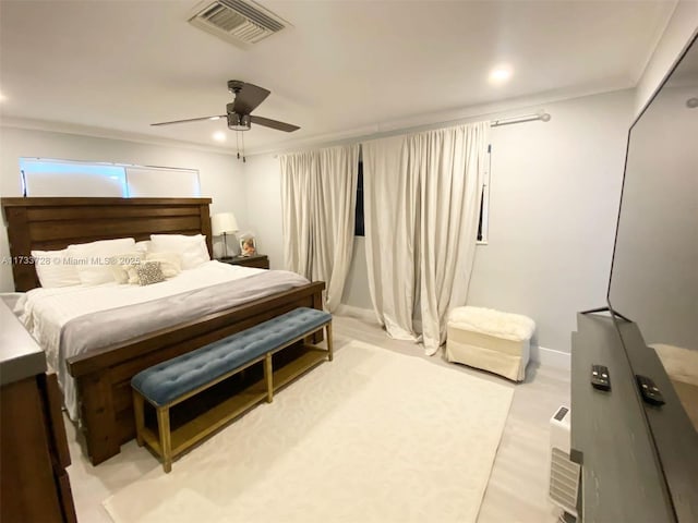 bedroom with crown molding and ceiling fan