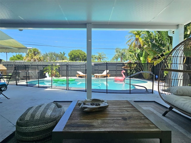 view of swimming pool featuring a patio area