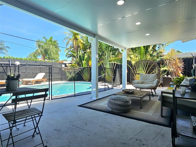 view of patio with a fenced in pool