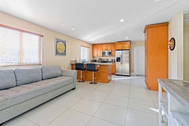 living room featuring light tile patterned flooring