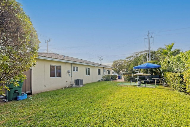 view of yard featuring central AC