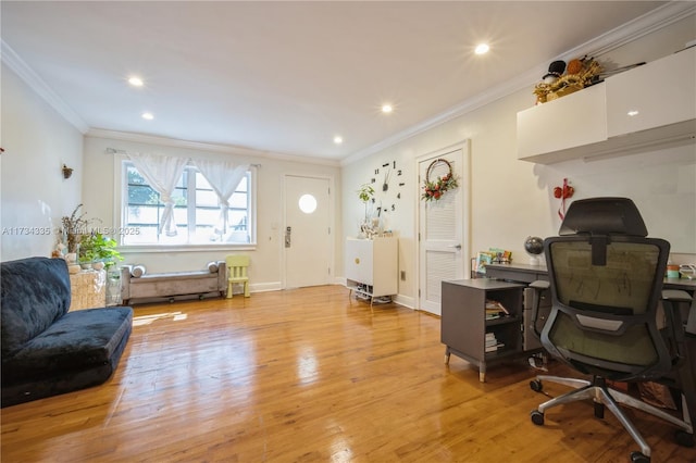 office area with ornamental molding and light hardwood / wood-style floors