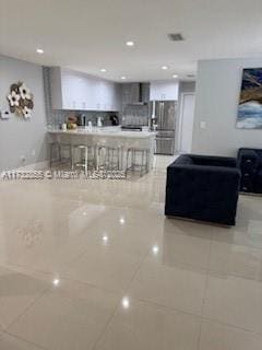 living room with tile patterned flooring