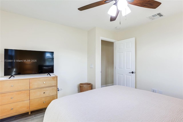 bedroom featuring wood-type flooring and ceiling fan