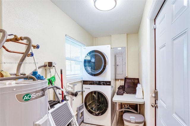 laundry room with stacked washer and dryer, electric panel, and water heater