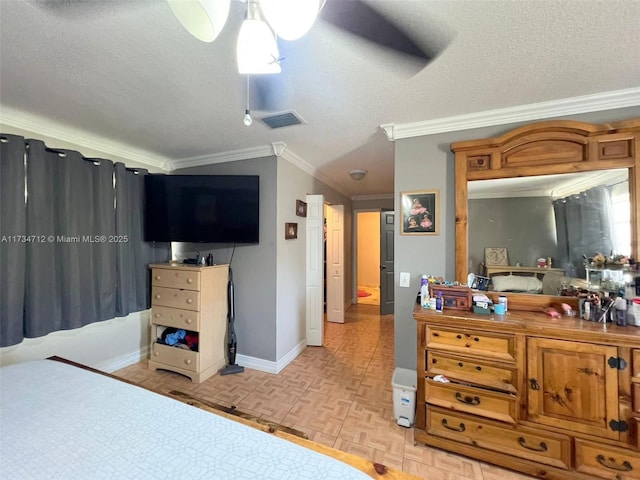 bedroom with ceiling fan, a textured ceiling, ornamental molding, and light parquet flooring