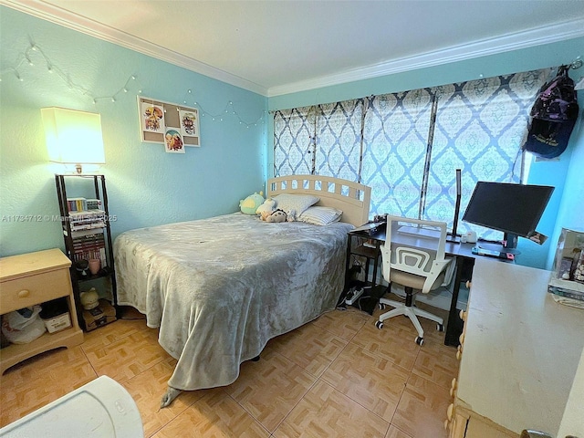 bedroom with light parquet flooring and crown molding