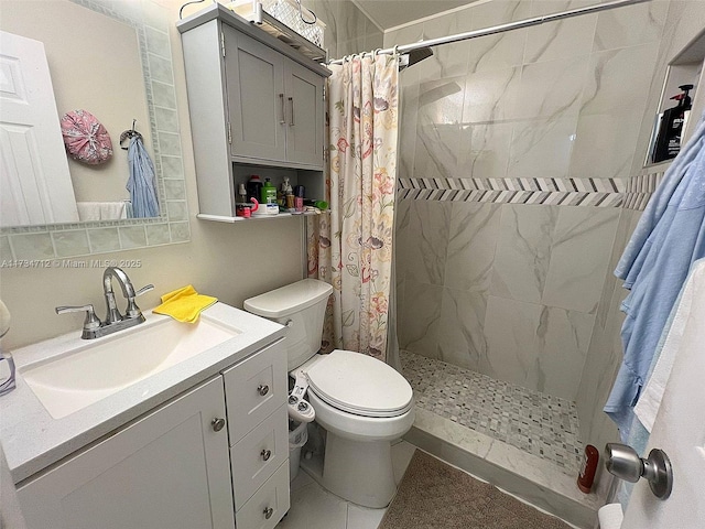 bathroom with vanity, toilet, and walk in shower