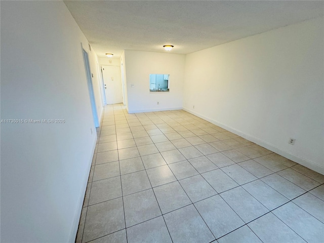 unfurnished room featuring a textured ceiling