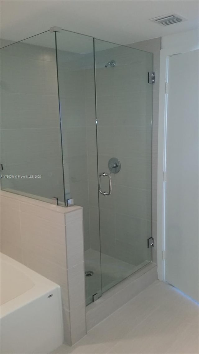 bathroom with independent shower and bath