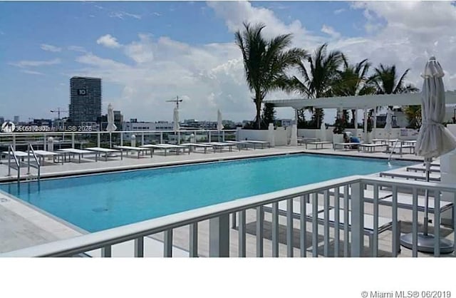 view of swimming pool featuring a patio area