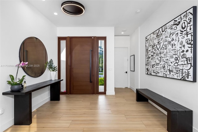 foyer entrance with light hardwood / wood-style floors