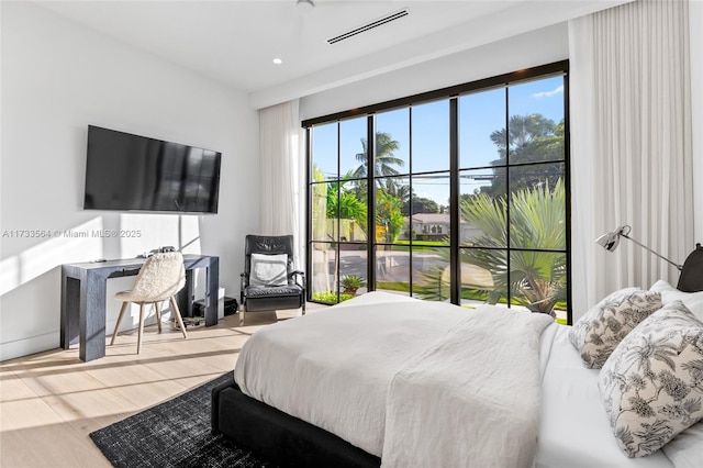 bedroom featuring wood-type flooring