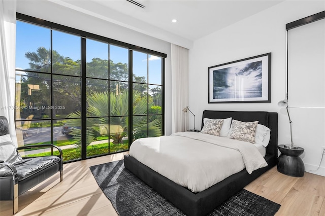 bedroom with light wood-type flooring