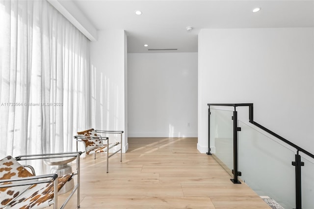 corridor featuring light hardwood / wood-style flooring