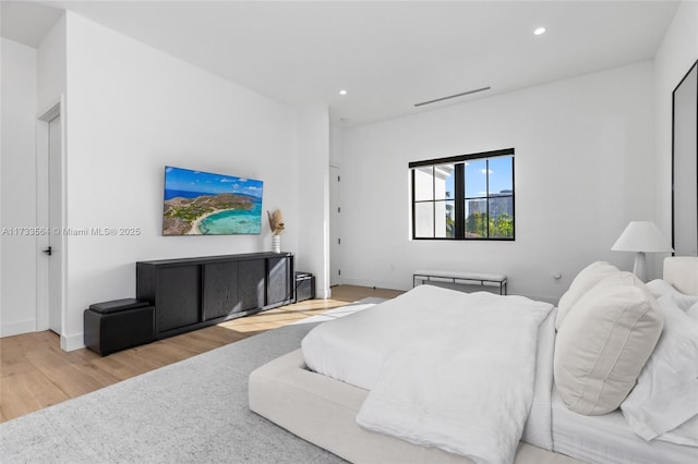 bedroom with light wood-type flooring