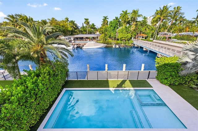 view of swimming pool with a water view