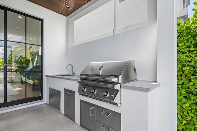 view of patio / terrace featuring grilling area, exterior kitchen, and sink