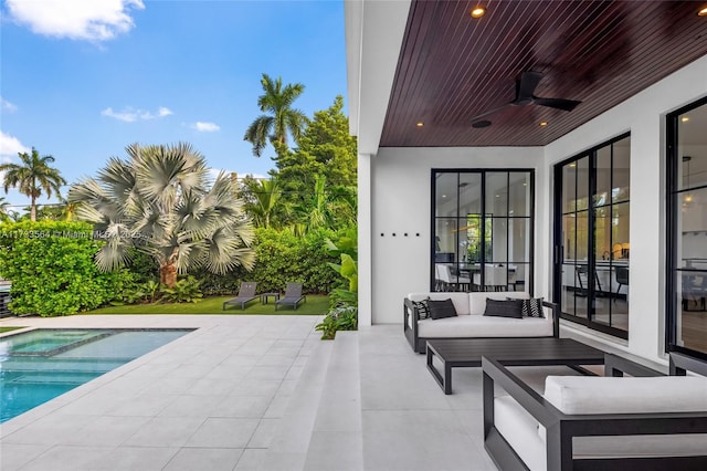 view of patio with outdoor lounge area and ceiling fan