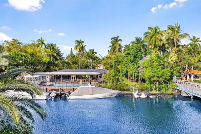 view of swimming pool featuring a water view