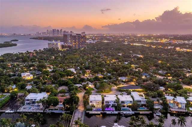 aerial view at dusk with a water view