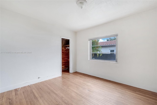 spare room with light hardwood / wood-style floors