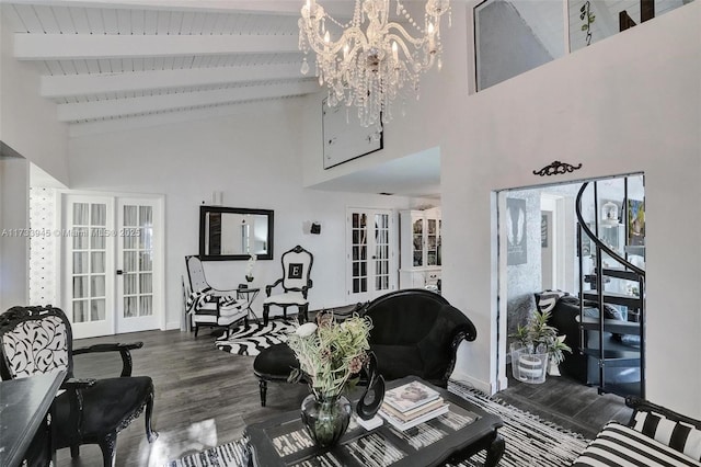 living room featuring french doors, baseboards, beam ceiling, and wood finished floors