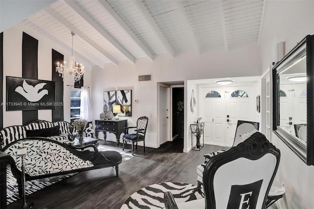 living area featuring beam ceiling, dark wood finished floors, visible vents, an inviting chandelier, and high vaulted ceiling