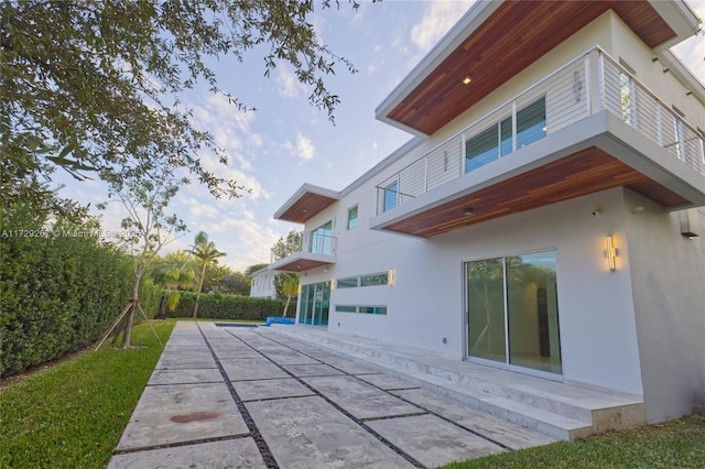 rear view of house featuring a patio area