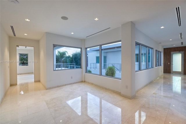 unfurnished room with plenty of natural light