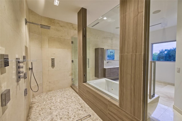 bathroom featuring tile patterned floors and shower with separate bathtub