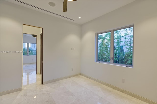 unfurnished room featuring ceiling fan