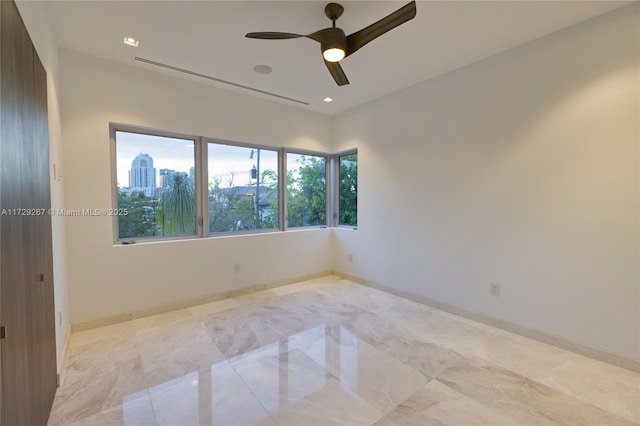 unfurnished room with ceiling fan