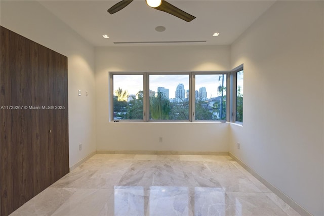 unfurnished room featuring ceiling fan