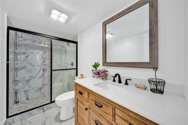 full bath featuring toilet, marble finish floor, a marble finish shower, and vanity