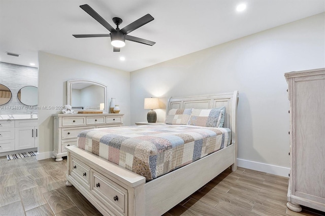 bedroom with ceiling fan and light hardwood / wood-style floors