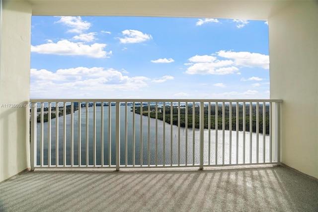 balcony featuring a water view