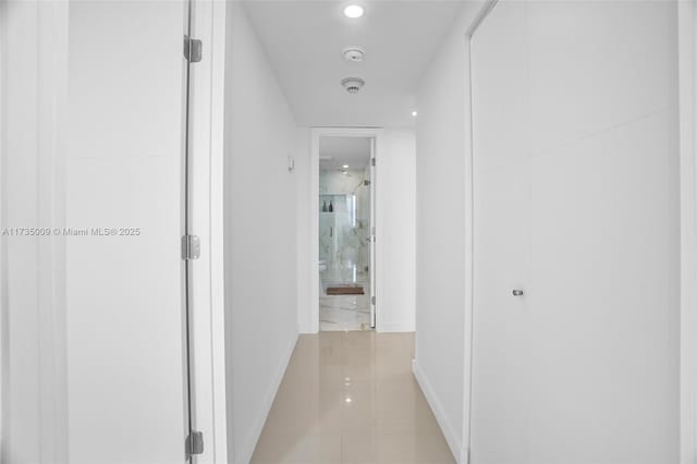 corridor featuring light tile patterned flooring