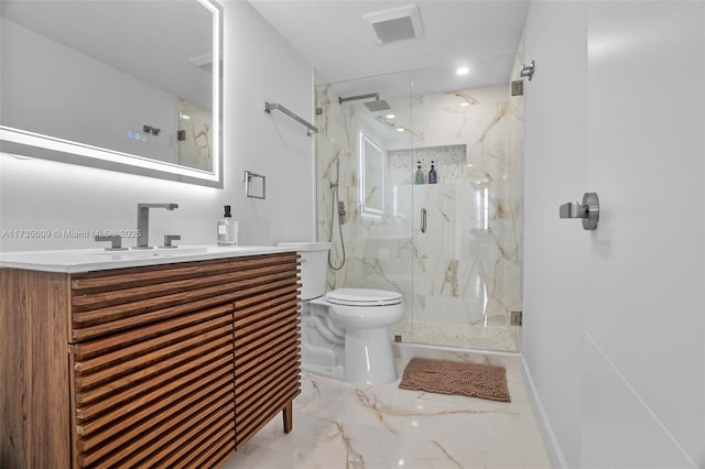 bathroom featuring vanity, toilet, and an enclosed shower