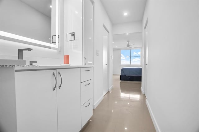 interior space featuring light tile patterned flooring and sink