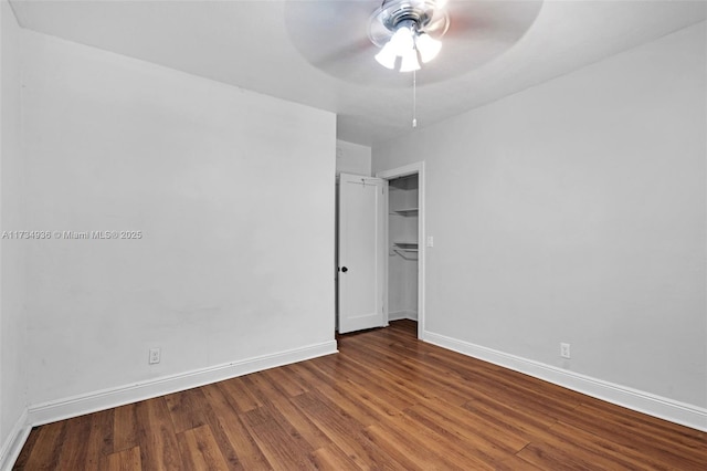 unfurnished bedroom featuring ceiling fan, hardwood / wood-style floors, and a closet