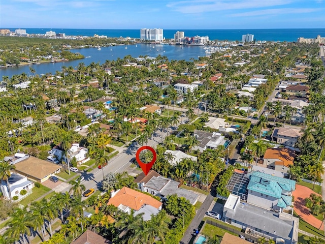 birds eye view of property featuring a water view