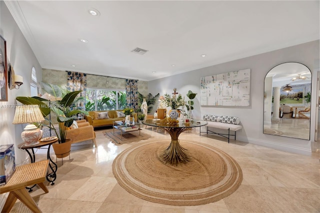 living room featuring crown molding